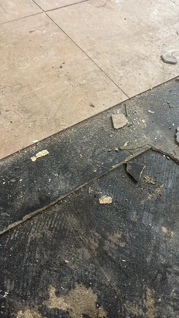 Black bitumen mastic floor removal in a NW10 flat